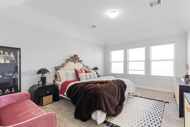 carpeted bedroom featuring lofted ceiling