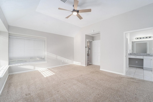 carpeted empty room with ceiling fan and lofted ceiling