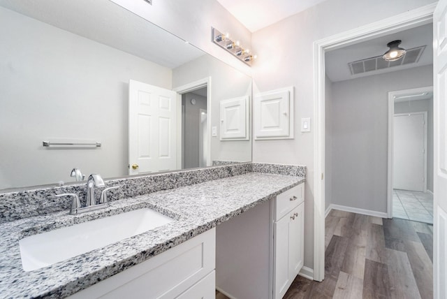 bathroom featuring vanity and hardwood / wood-style flooring