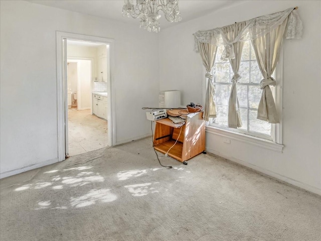 interior space featuring a healthy amount of sunlight and a notable chandelier