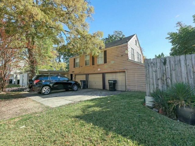 view of property exterior with a yard and a garage