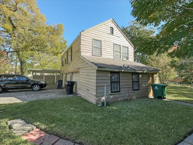 view of property exterior with a yard and a garage