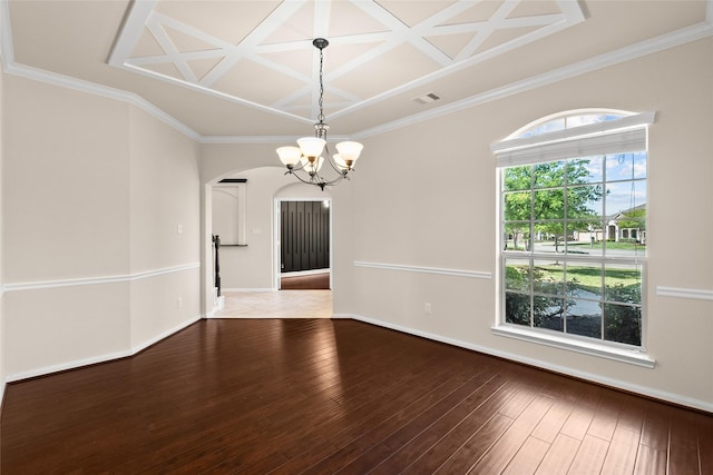 unfurnished room with an inviting chandelier, coffered ceiling, hardwood / wood-style floors, and crown molding