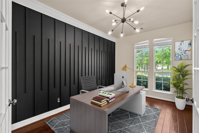 home office with an inviting chandelier and dark hardwood / wood-style floors