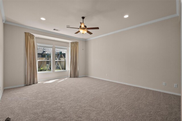 unfurnished room featuring ornamental molding, ceiling fan, and carpet flooring