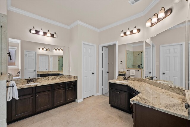 bathroom with ornamental molding, vanity, and walk in shower