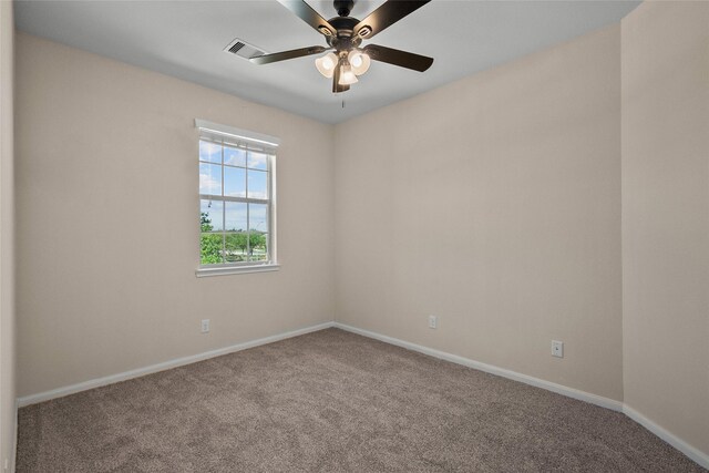 carpeted empty room featuring ceiling fan