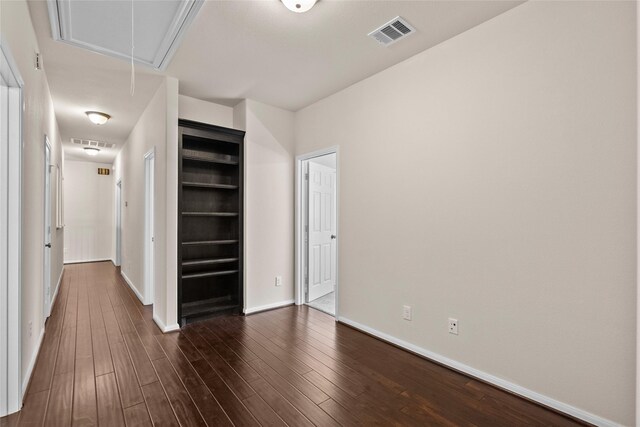 spare room featuring dark hardwood / wood-style flooring