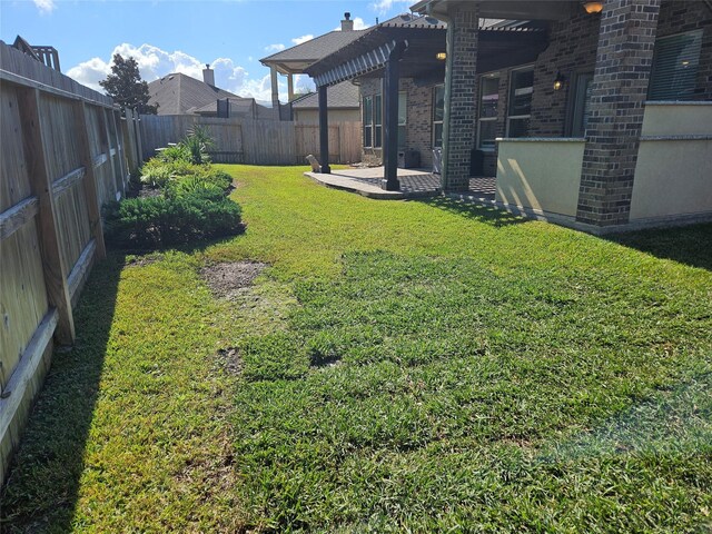 view of yard with a pergola and a patio area