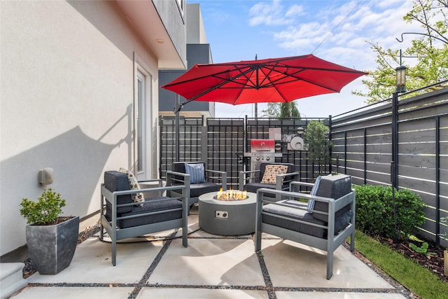 view of patio / terrace with a fire pit