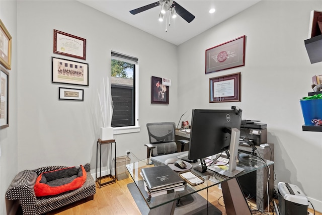 office featuring ceiling fan and light hardwood / wood-style flooring