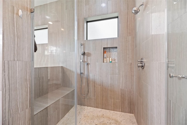 bathroom with a tile shower