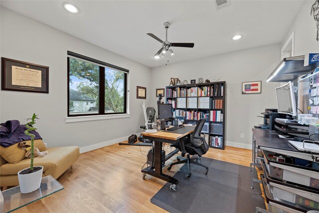 office space featuring light wood-type flooring and ceiling fan