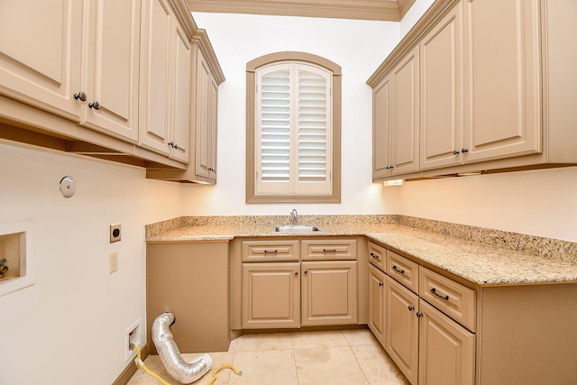 washroom featuring hookup for an electric dryer, light tile patterned floors, cabinets, and sink