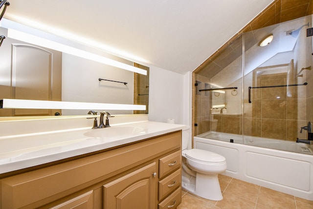 full bathroom featuring tile patterned floors, bath / shower combo with glass door, vanity, toilet, and lofted ceiling