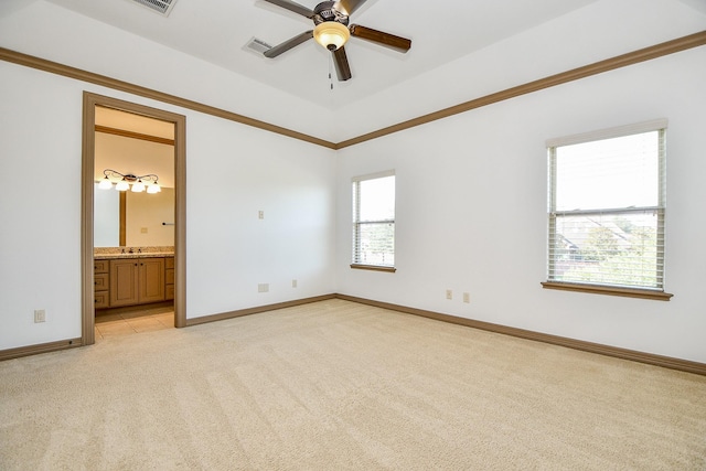 unfurnished bedroom with ensuite bath, ceiling fan, and light colored carpet