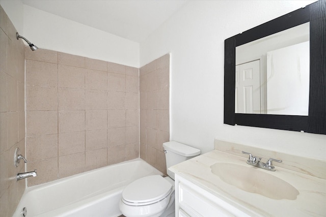 full bathroom with vanity, toilet, and tiled shower / bath