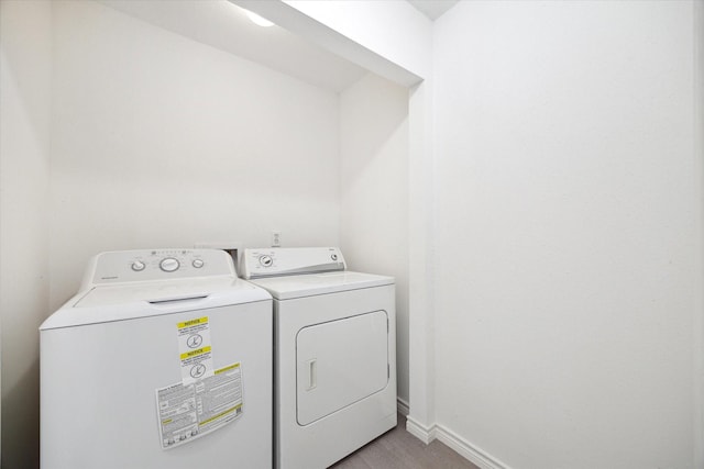 clothes washing area featuring washing machine and clothes dryer