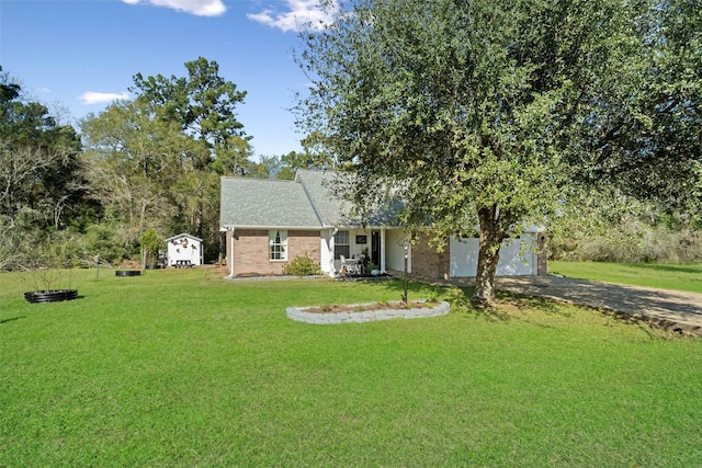 view of front of home with a garage and a front yard