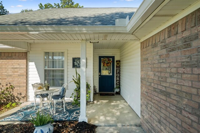 doorway to property with a porch