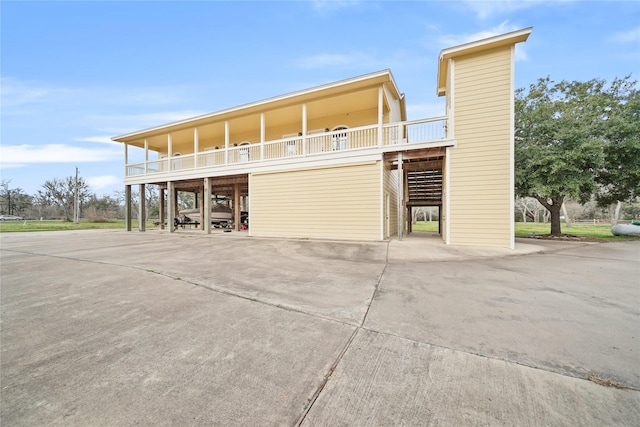 coastal home featuring a carport and a balcony