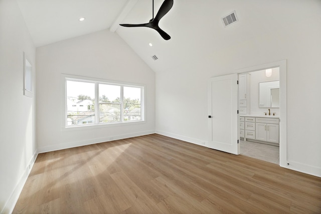 unfurnished living room featuring beamed ceiling, ceiling fan, high vaulted ceiling, and light hardwood / wood-style floors