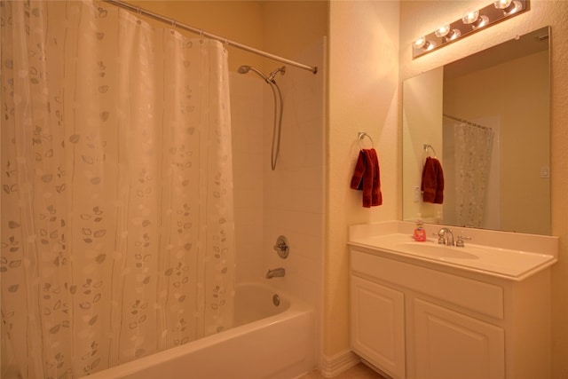 bathroom featuring shower / bath combo and vanity