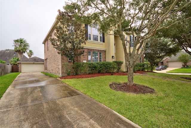 view of front of property with a front yard and a garage