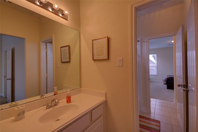 bathroom featuring tile patterned flooring and vanity