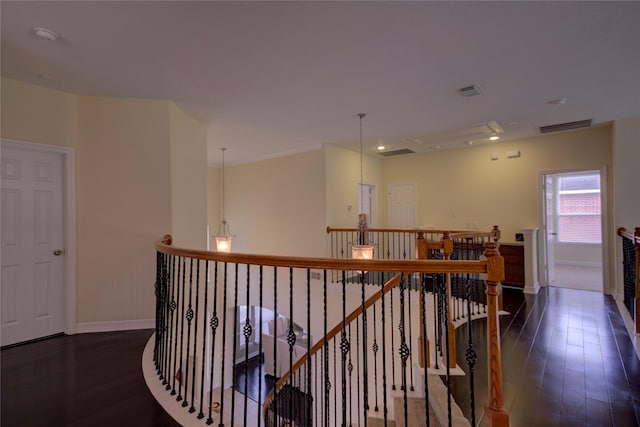 corridor with dark hardwood / wood-style flooring