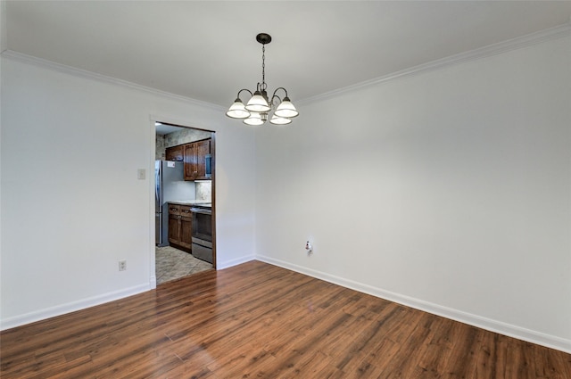 unfurnished dining area with a notable chandelier, ornamental molding, wood finished floors, and baseboards