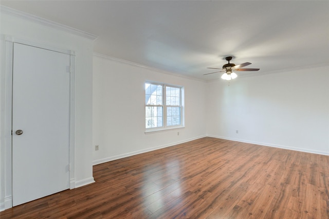 unfurnished room with baseboards, ceiling fan, dark wood-style flooring, and crown molding