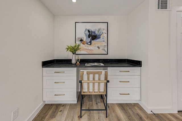 unfurnished office featuring light wood-type flooring