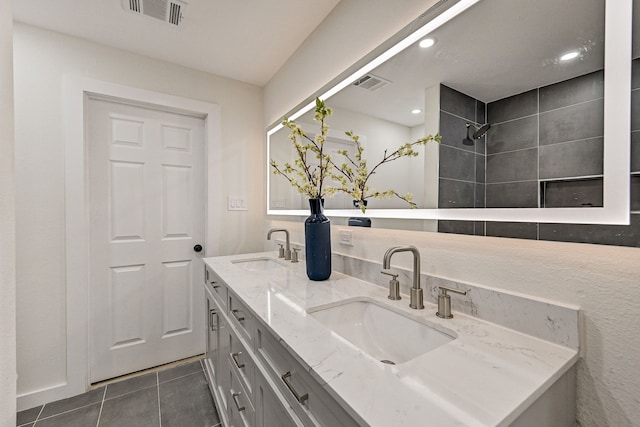 bathroom featuring tile patterned flooring and vanity