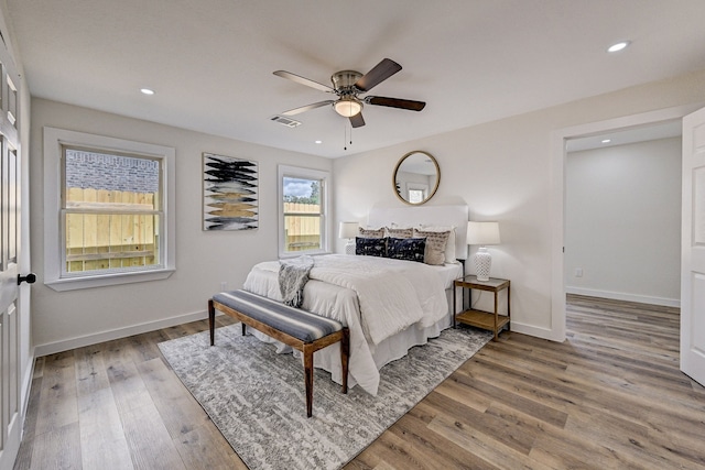 bedroom with hardwood / wood-style flooring and ceiling fan