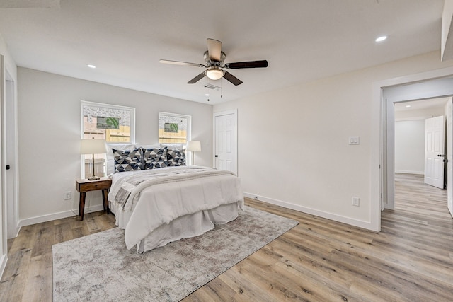 bedroom featuring light wood-type flooring and ceiling fan