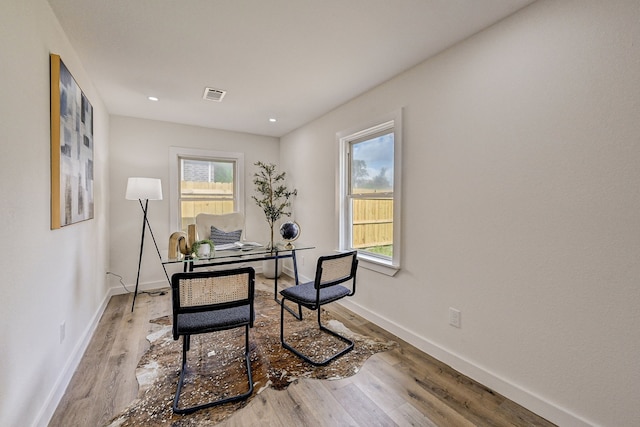 home office featuring light wood-type flooring and a wealth of natural light