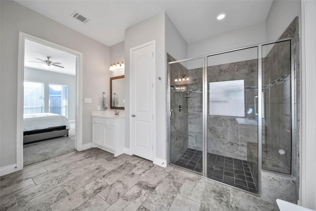 bathroom with vanity, ceiling fan, and a shower with shower door