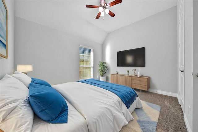 bedroom with carpet floors, vaulted ceiling, and ceiling fan