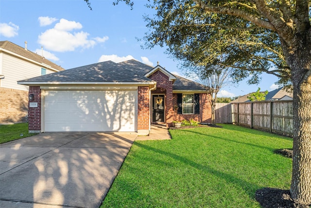 view of front of home with a front lawn and a garage