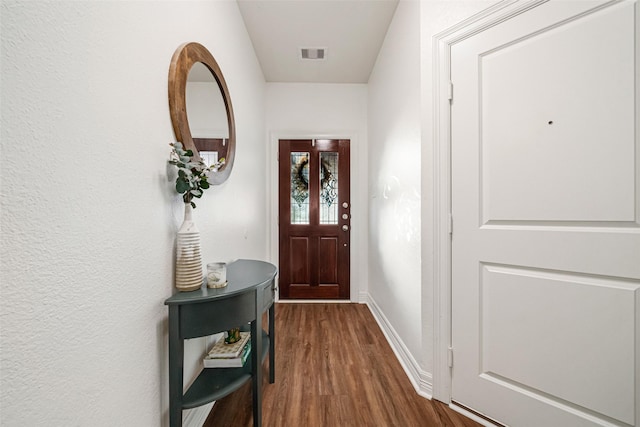 doorway to outside featuring dark hardwood / wood-style floors