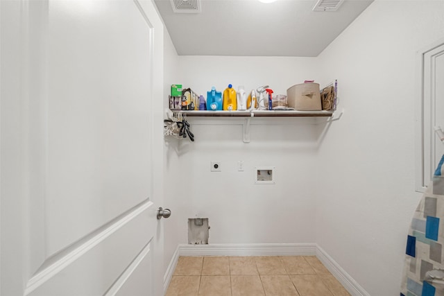 laundry room featuring gas dryer hookup, hookup for a washing machine, light tile patterned floors, and hookup for an electric dryer