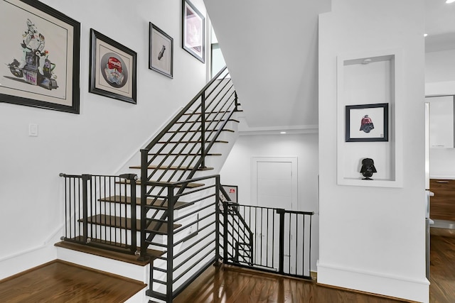 stairs featuring wood-type flooring