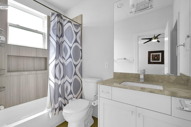 full bathroom with shower / tub combo with curtain, vanity, toilet, and ceiling fan