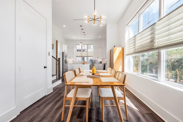 dining room featuring a notable chandelier and dark hardwood / wood-style flooring