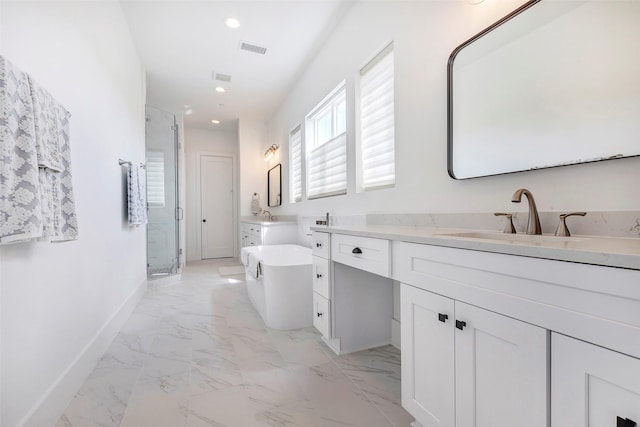 bathroom with vanity and shower with separate bathtub