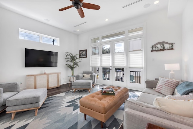 living room with hardwood / wood-style floors and ceiling fan