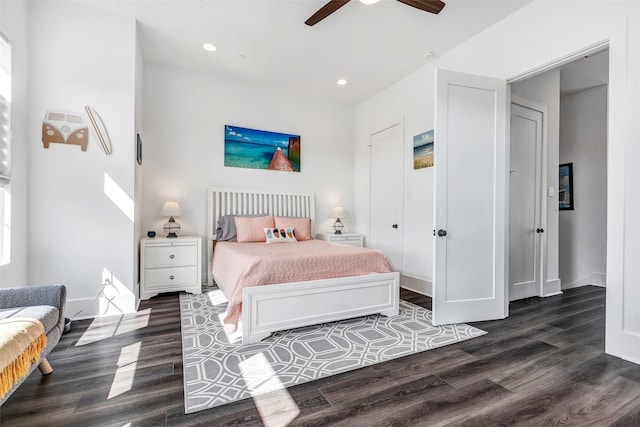 bedroom featuring ceiling fan and dark hardwood / wood-style floors