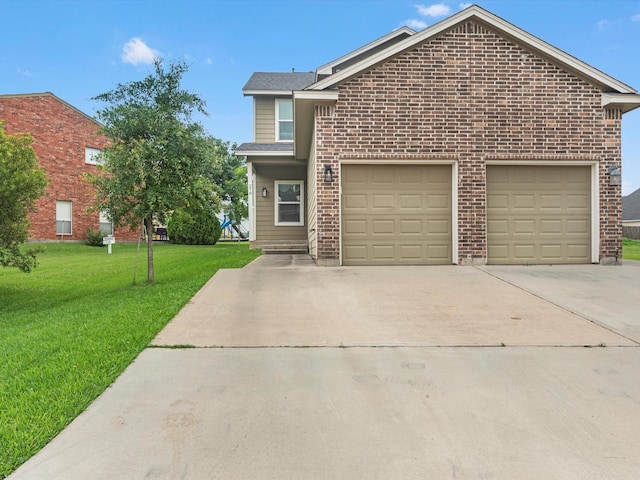 front of property featuring a front lawn and a garage