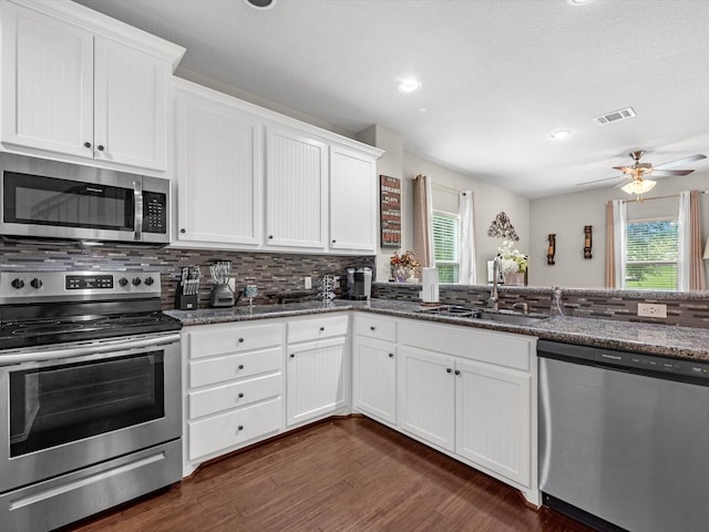 kitchen featuring sink, white cabinetry, and stainless steel appliances